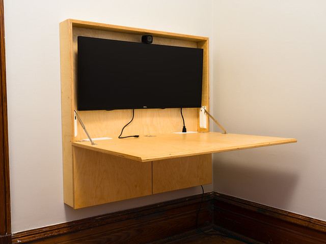 A convertible, fold-down desk. It is currently open with the desk folded down. Made from baltic birch.