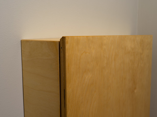 A convertible, fold-down desk. A detail view of the top of the desk portion. I used a 45 degree chamfer on the edge for comfort and as a call back to other pieces that have the same feature. Made from baltic birch.